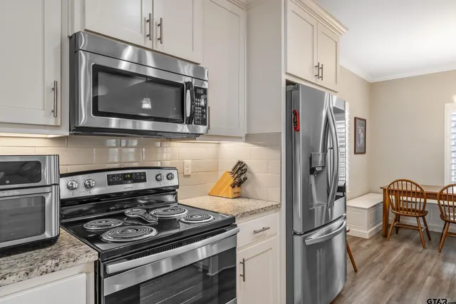 a kitchen with a stove and a microwave