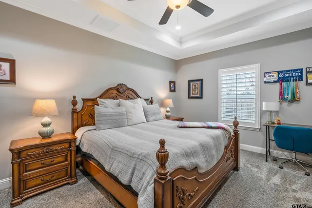 a bedroom with furniture and a window