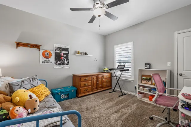 a view of a workspace with furniture and toys