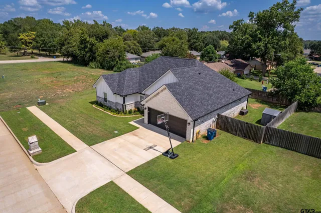 an aerial view of a house having yard