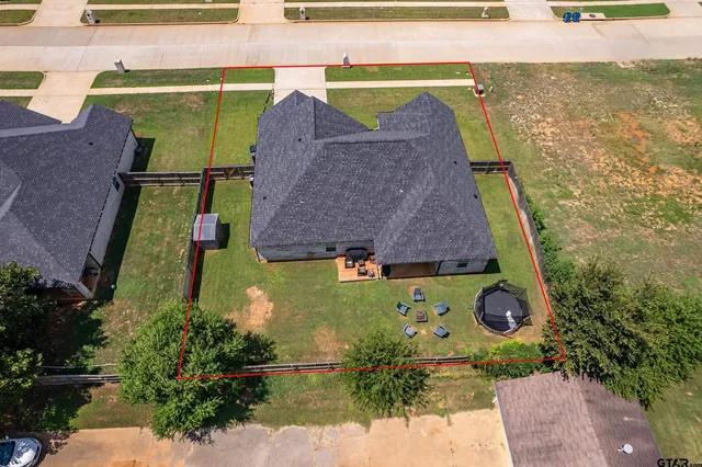 an aerial view of a house with a garden
