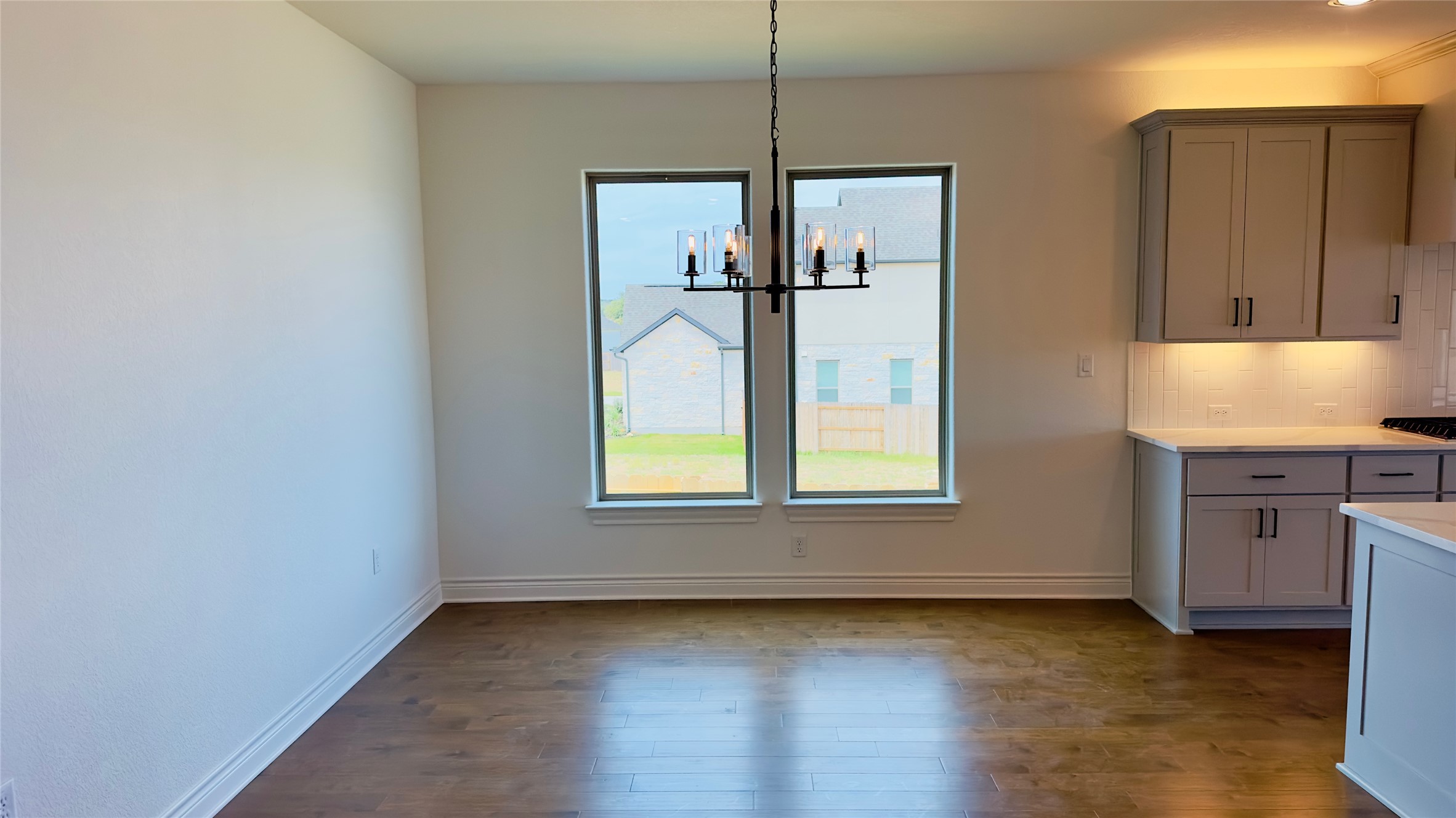 150 Firethorn Loop Bastrop, TX 78602 - Photo 13 of 39 a view of an empty room with window and wooden floor