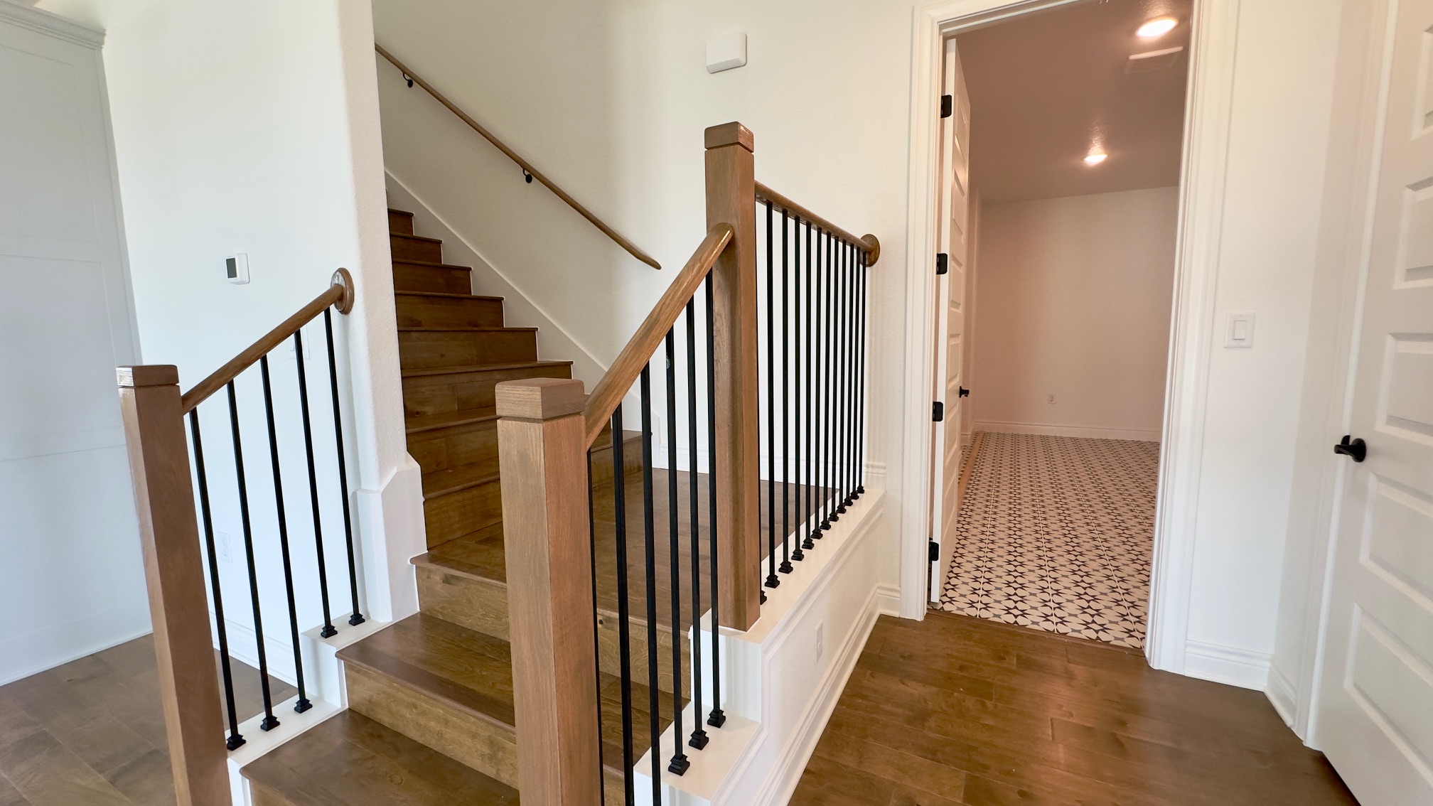150 Firethorn Loop Bastrop, TX 78602 - Photo 29 of 39 a view of a hallway with a door and stairs