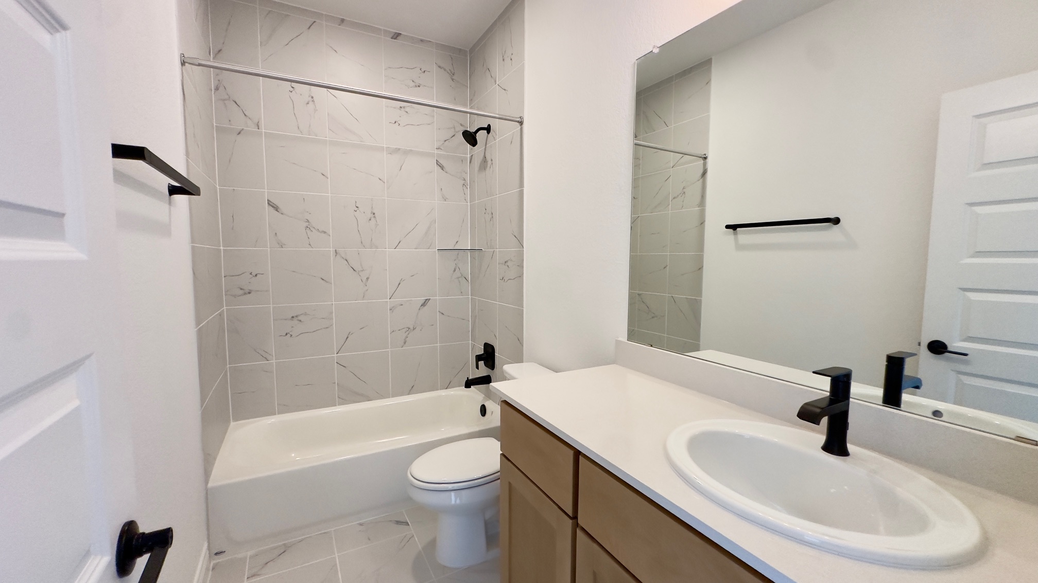 150 Firethorn Loop Bastrop, TX 78602 - Photo 30 of 39 a bathroom with a sink toilet and shower