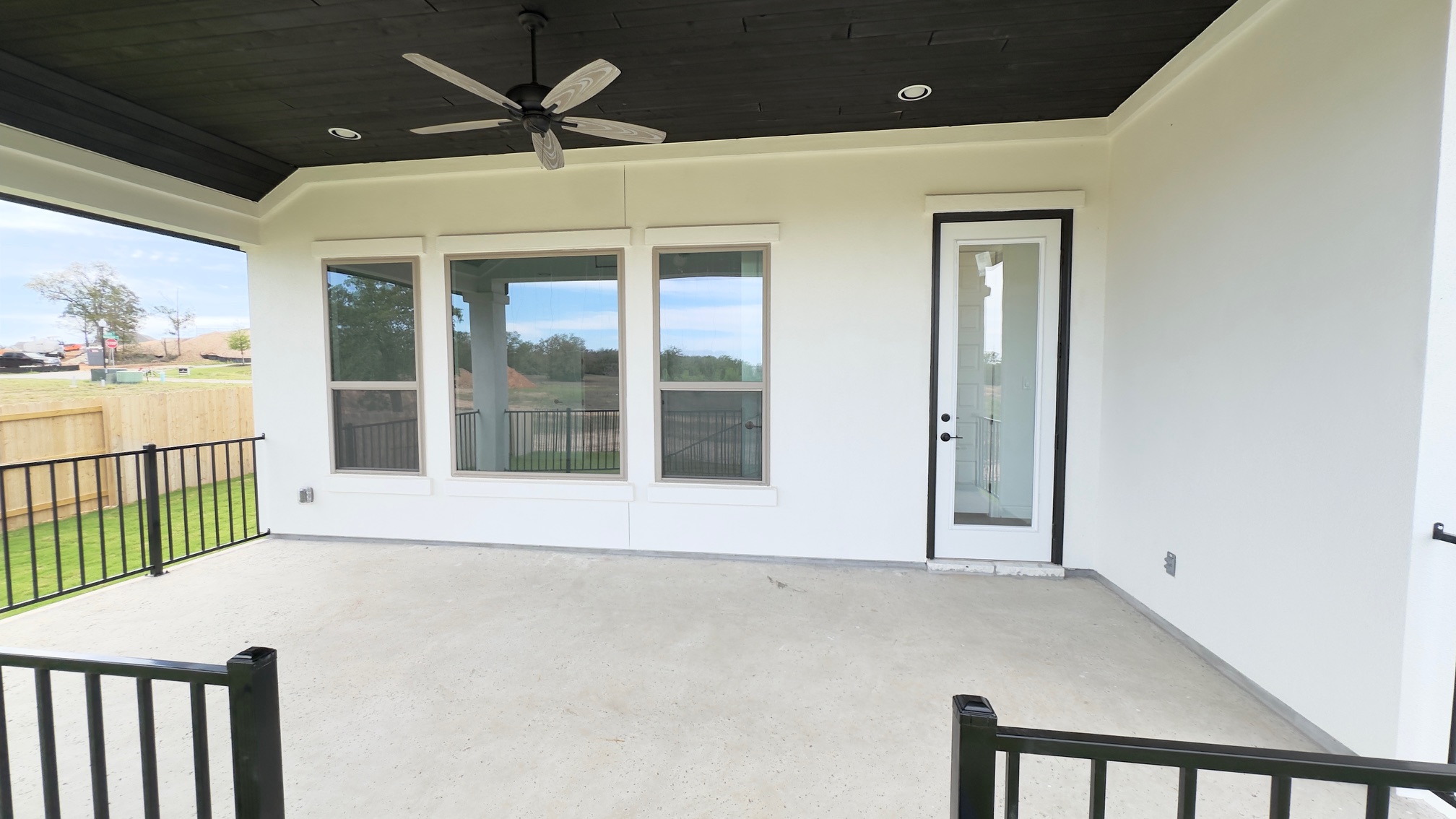 150 Firethorn Loop Bastrop, TX 78602 - Photo 34 of 39 a front view of a house with a ceiling fan and window