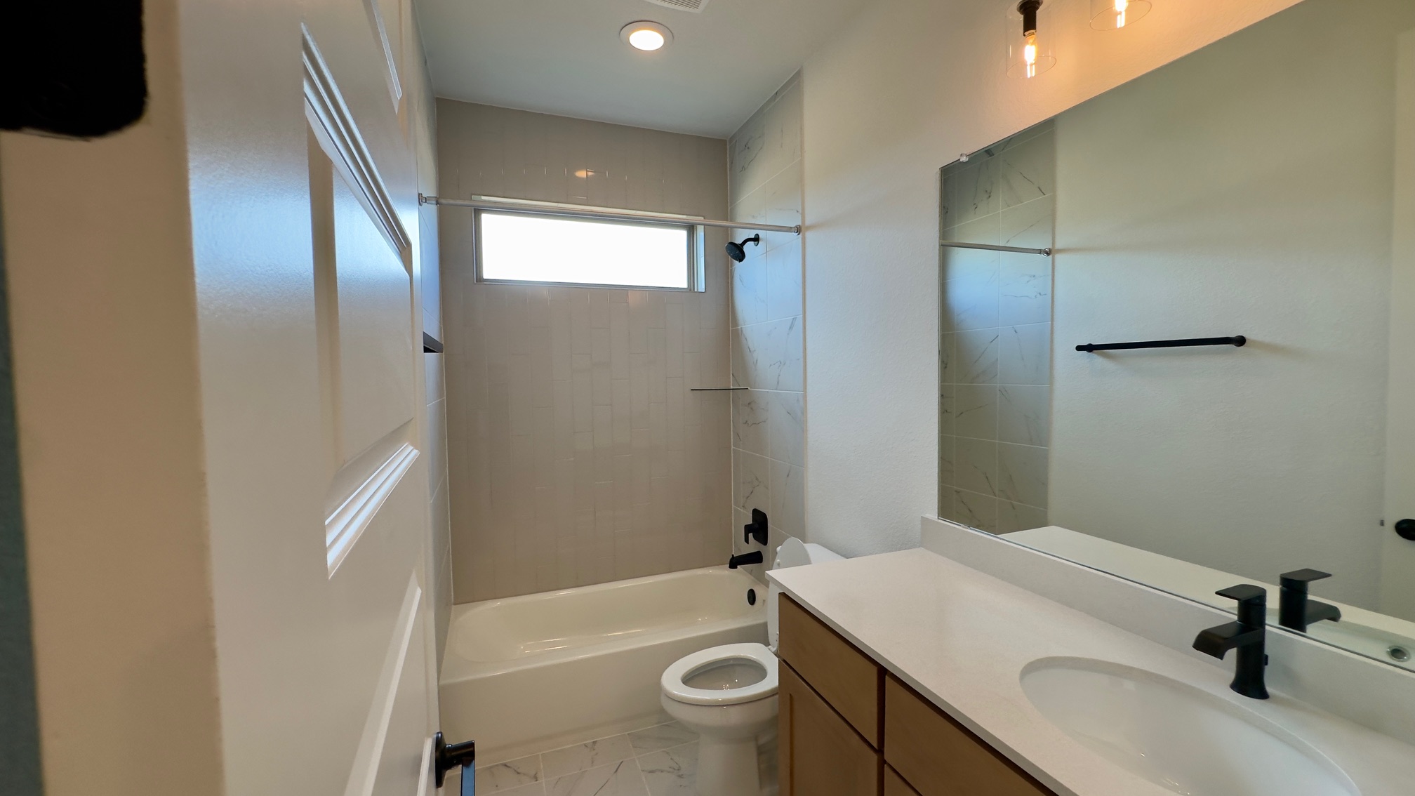 150 Firethorn Loop Bastrop, TX 78602 - Photo 8 of 39 a bathroom with a sink a toilet and shower