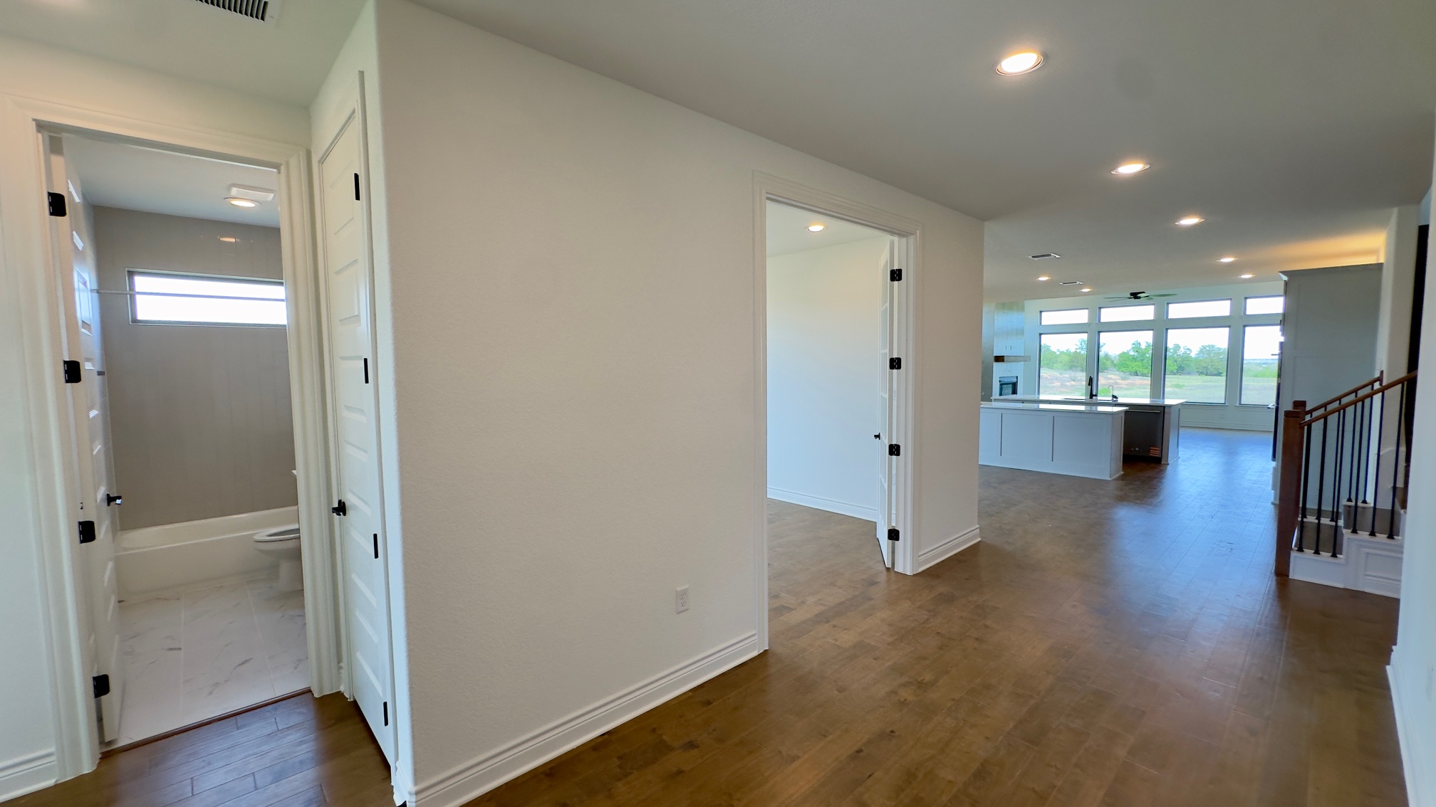 150 Firethorn Loop Bastrop, TX 78602 - Photo 9 of 39 a view of a hallway with wooden floor