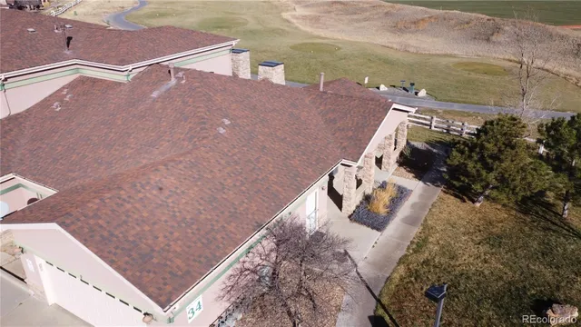 an aerial view of a house with a ocean view