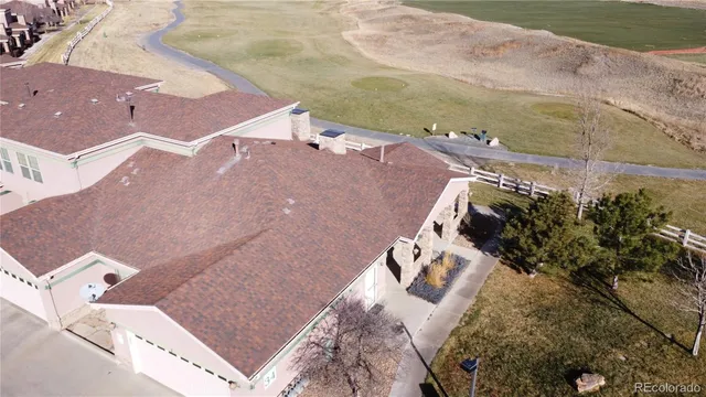 an aerial view of a house with a lake view