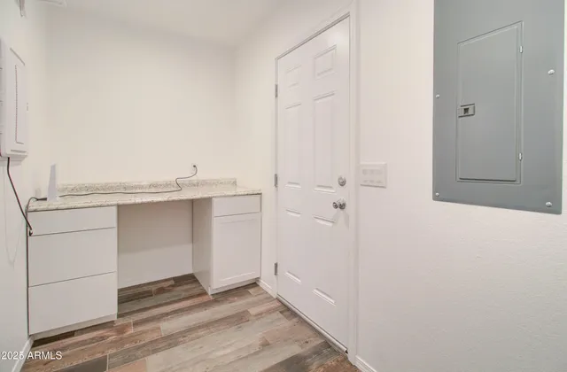 a kitchen with granite countertop cabinets stainless steel appliances and a sink