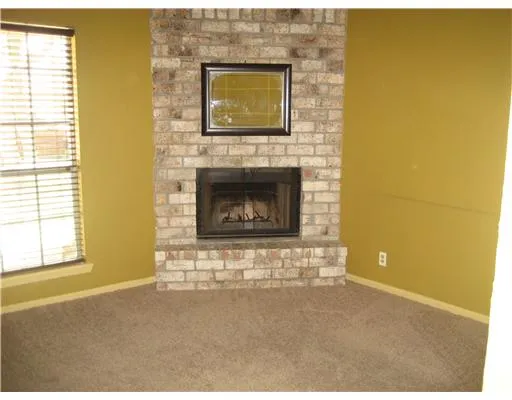 a living room with a fireplace