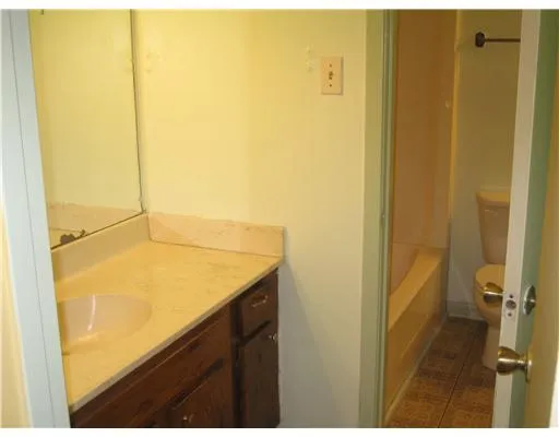 a bathroom with a shower and a sink