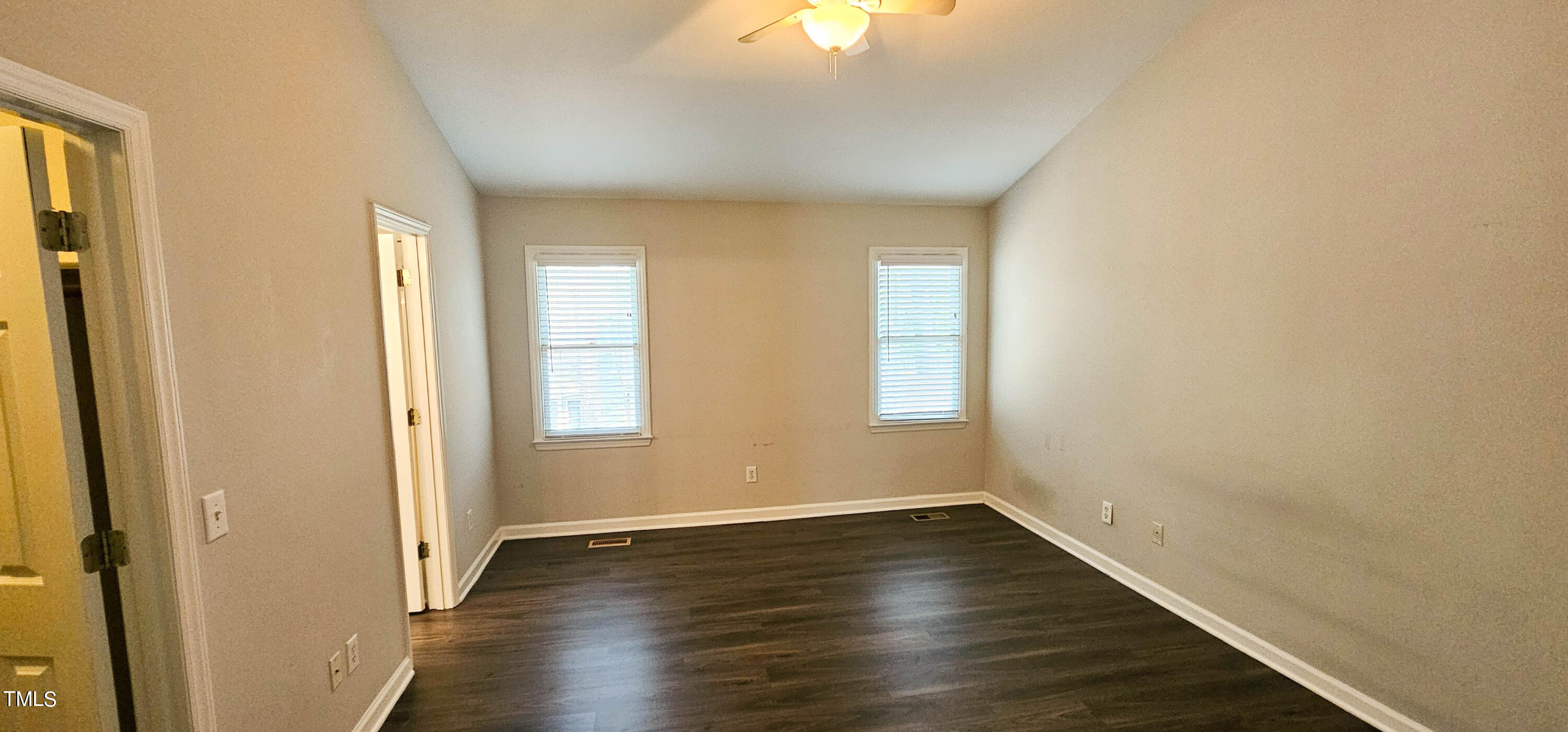 2141 Leadenhall Way Raleigh, NC 27603 - Photo 12 of 24 an empty room with wooden floor and windows