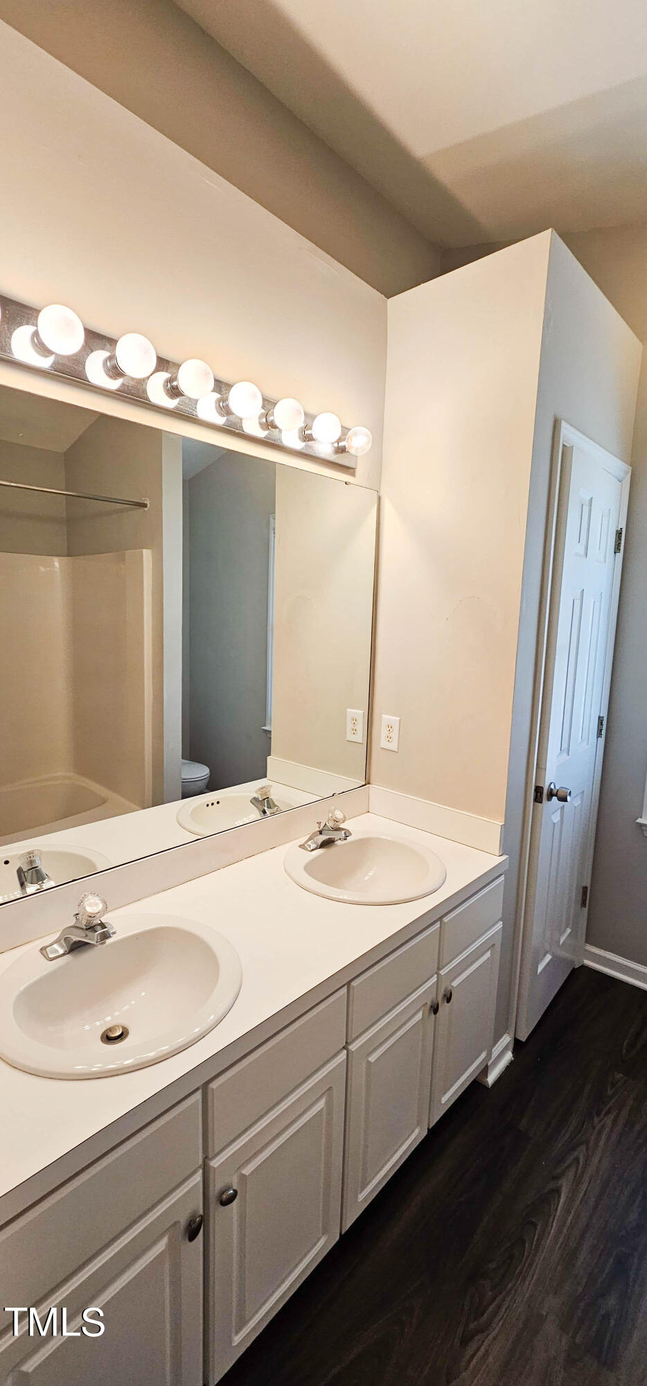 2141 Leadenhall Way Raleigh, NC 27603 - Photo 13 of 24 a bathroom with a sink and a mirror