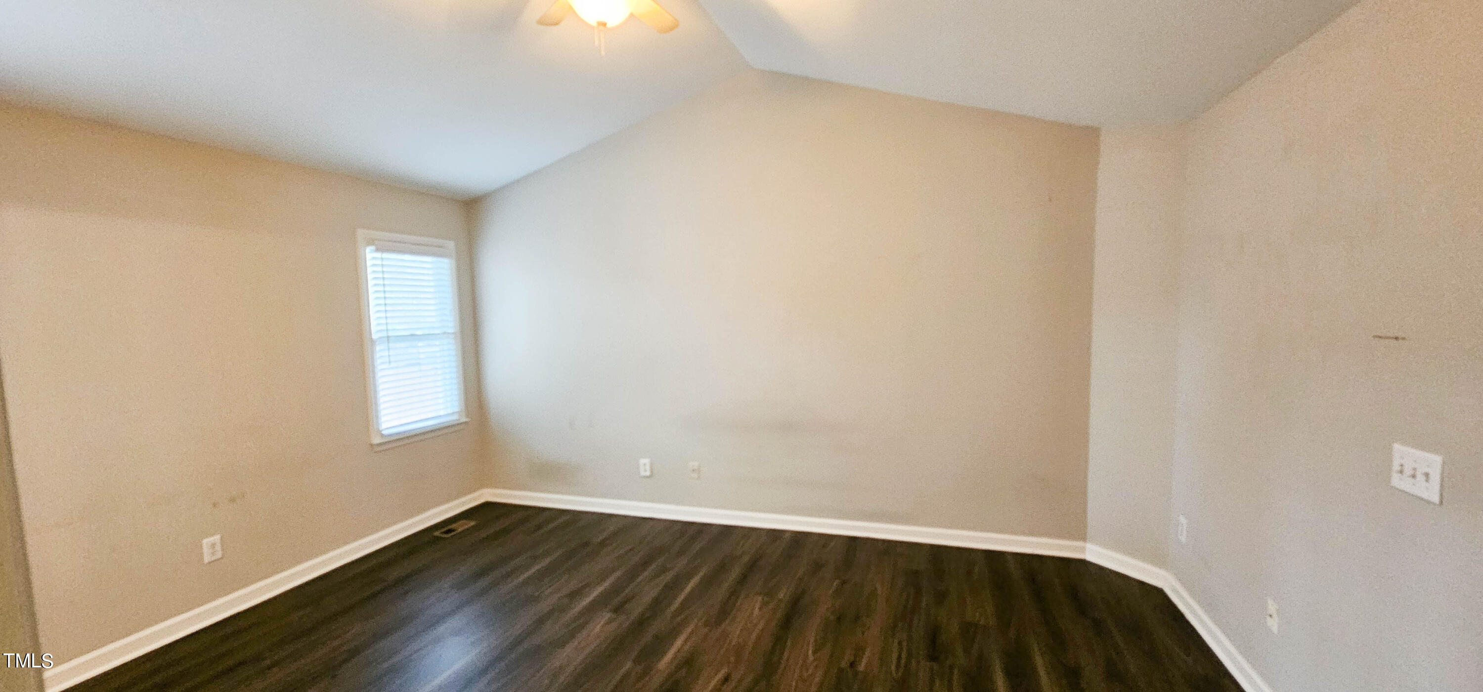 2141 Leadenhall Way Raleigh, NC 27603 - Photo 15 of 24 a view of an empty room with wooden floor and a window