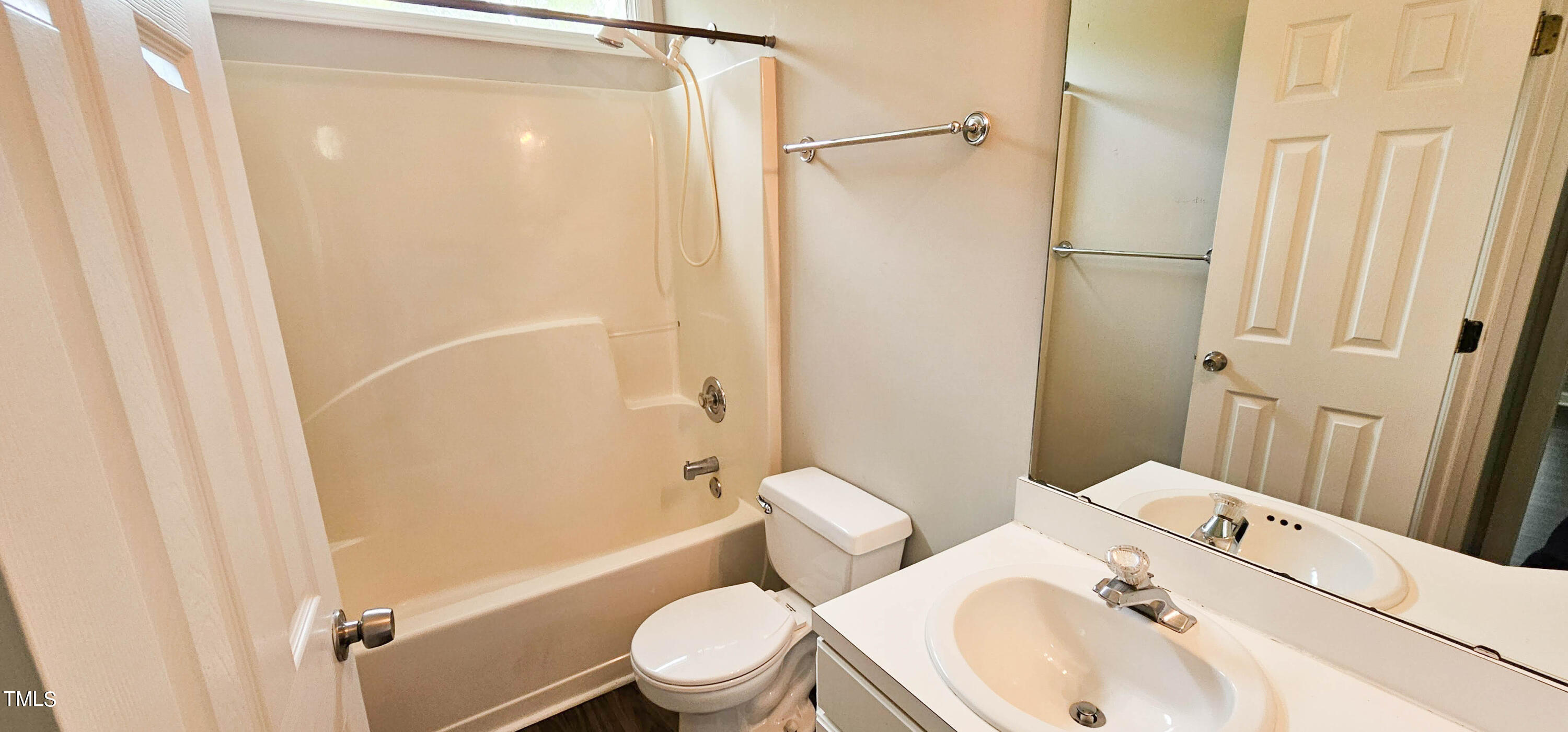2141 Leadenhall Way Raleigh, NC 27603 - Photo 16 of 24 a white toilet sitting next to a bathroom sink