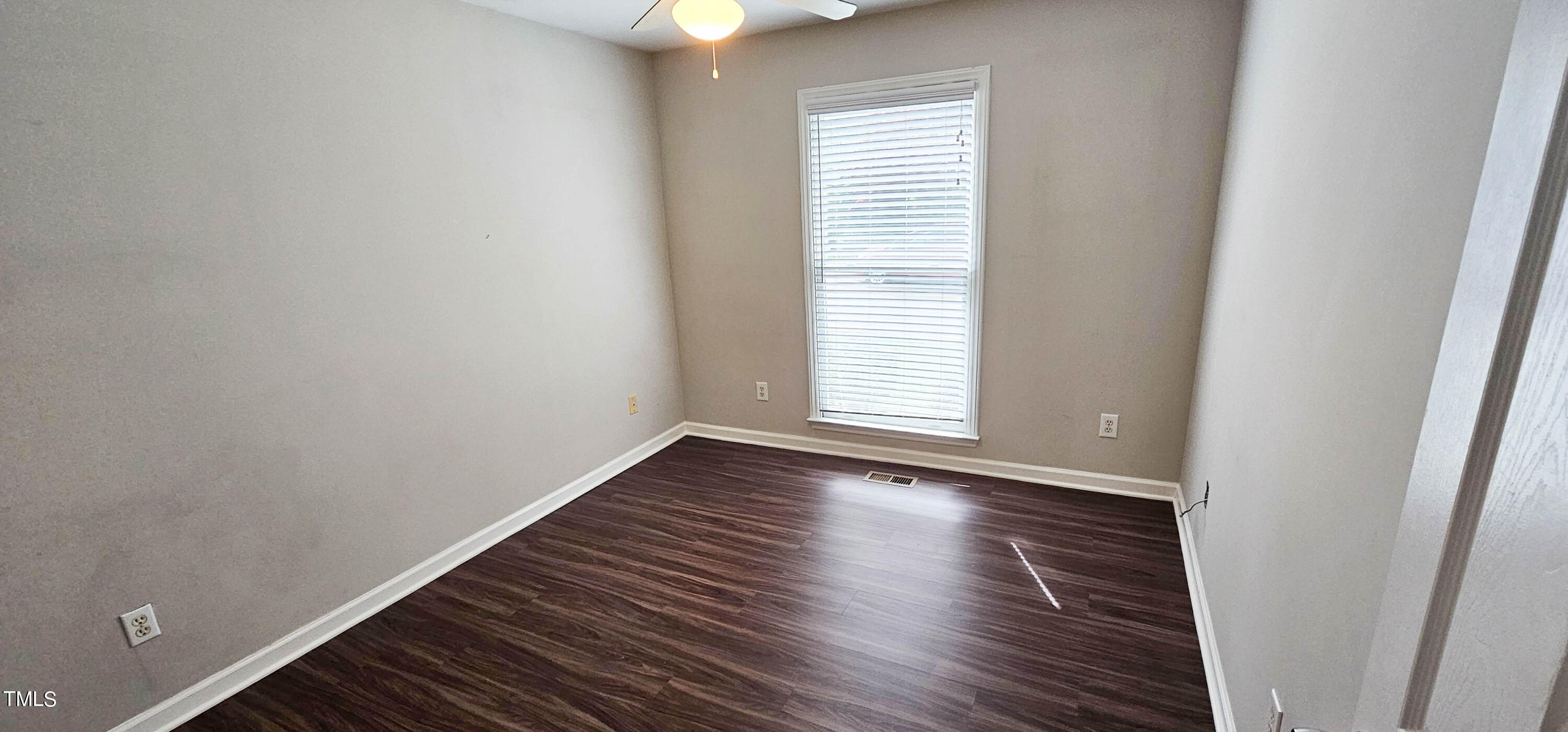 2141 Leadenhall Way Raleigh, NC 27603 - Photo 18 of 24 an empty room with wooden floor and windows