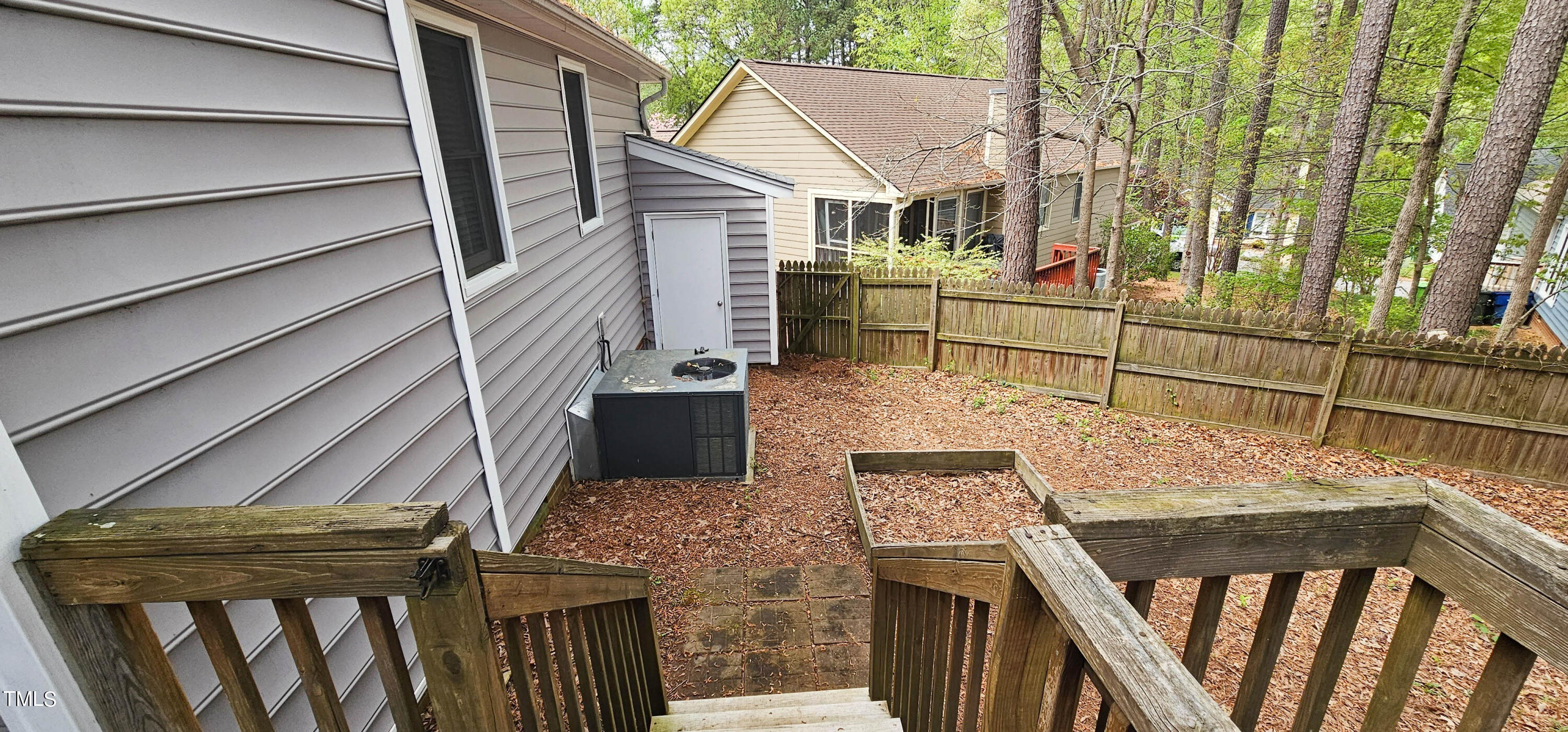 2141 Leadenhall Way Raleigh, NC 27603 - Photo 22 of 24 a view of a house with wooden deck front door