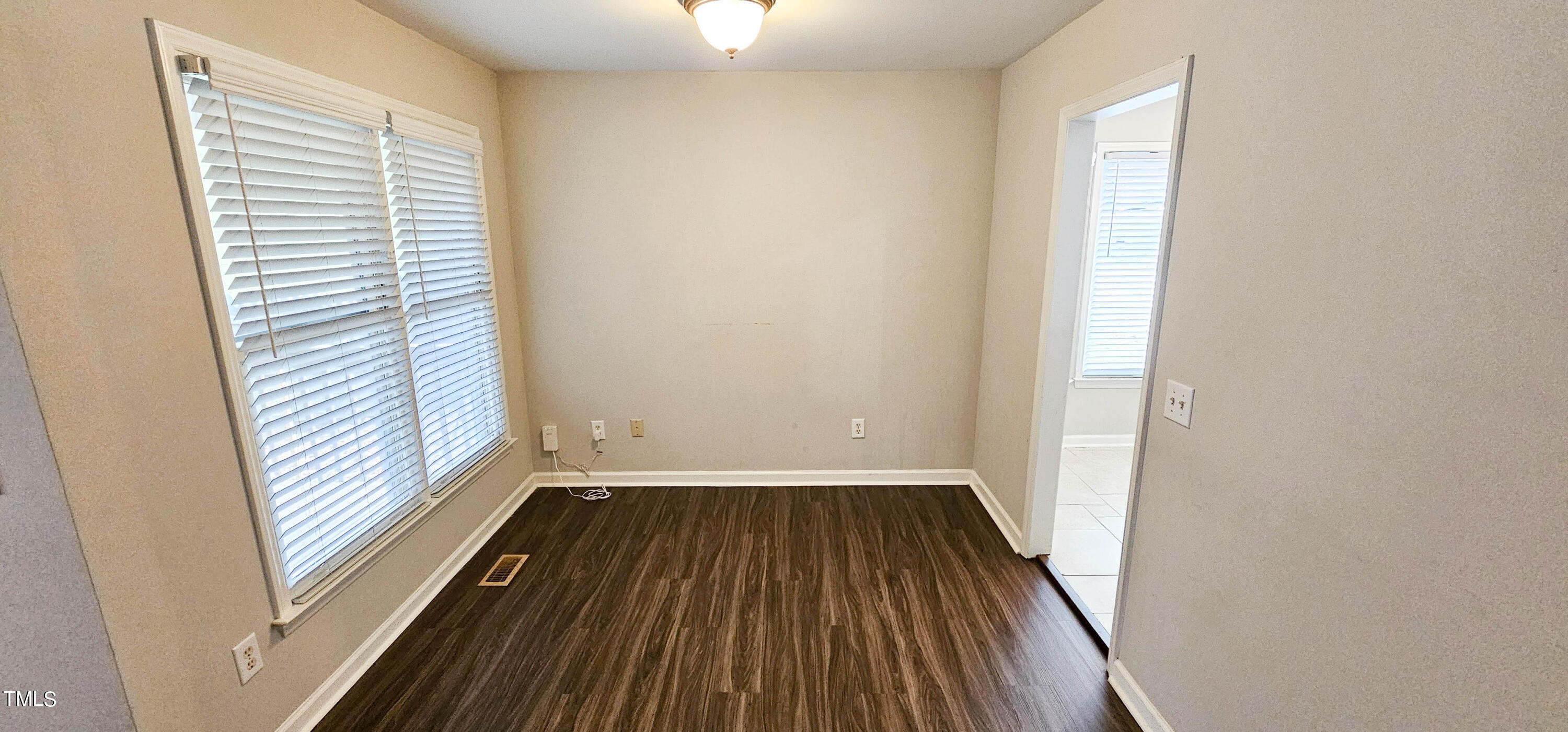 2141 Leadenhall Way Raleigh, NC 27603 - Photo 6 of 24 a view of a room with wooden floor and a window