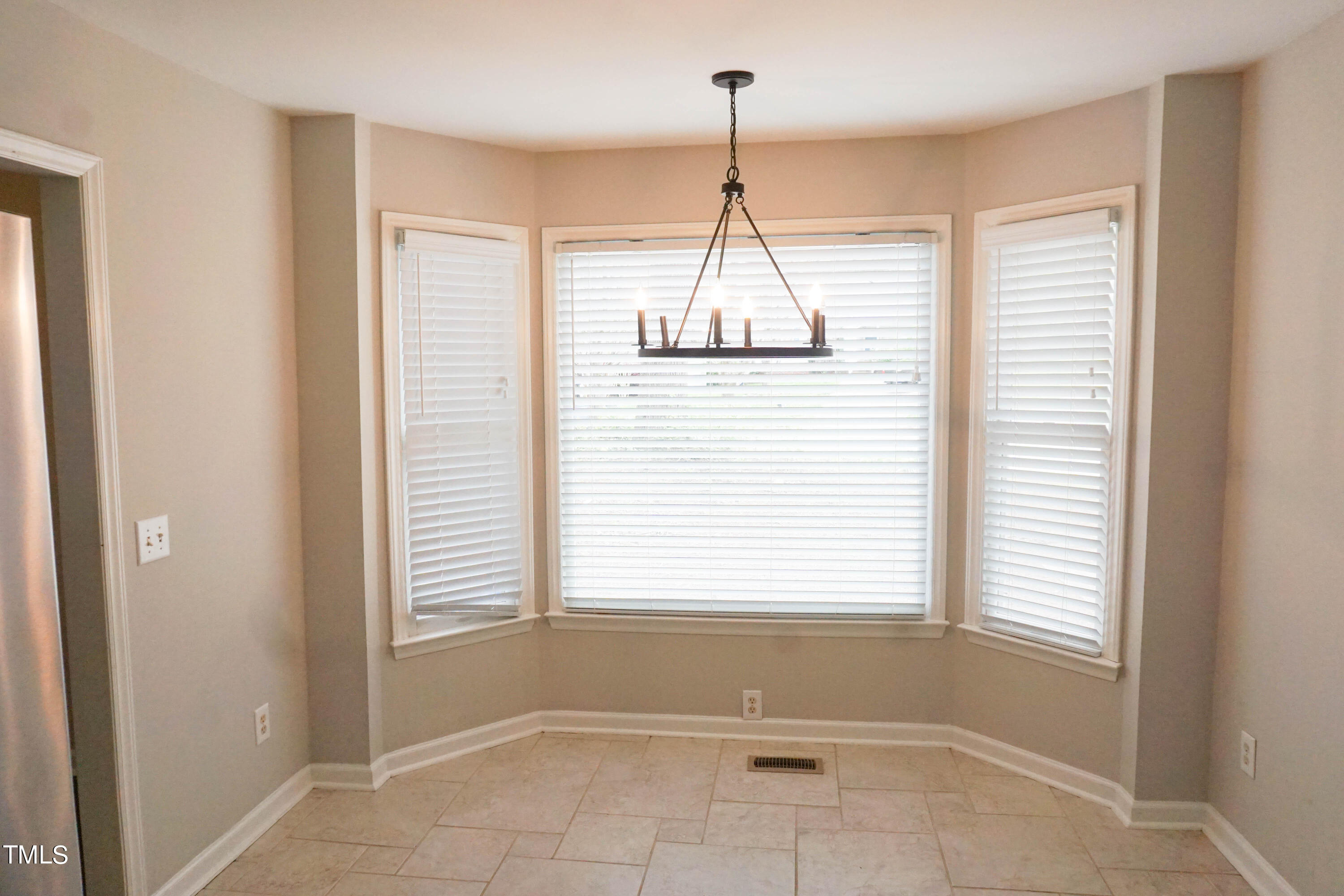 2141 Leadenhall Way Raleigh, NC 27603 - Photo 8 of 24 a view of an empty room with a window
