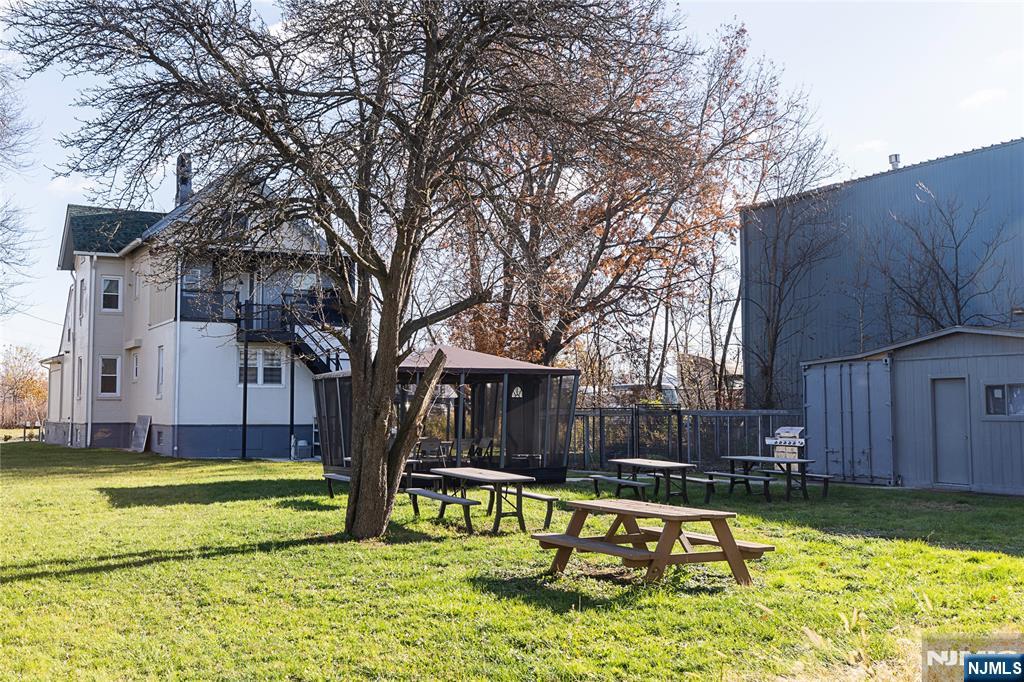 a view of swimming pool with a patio and yard