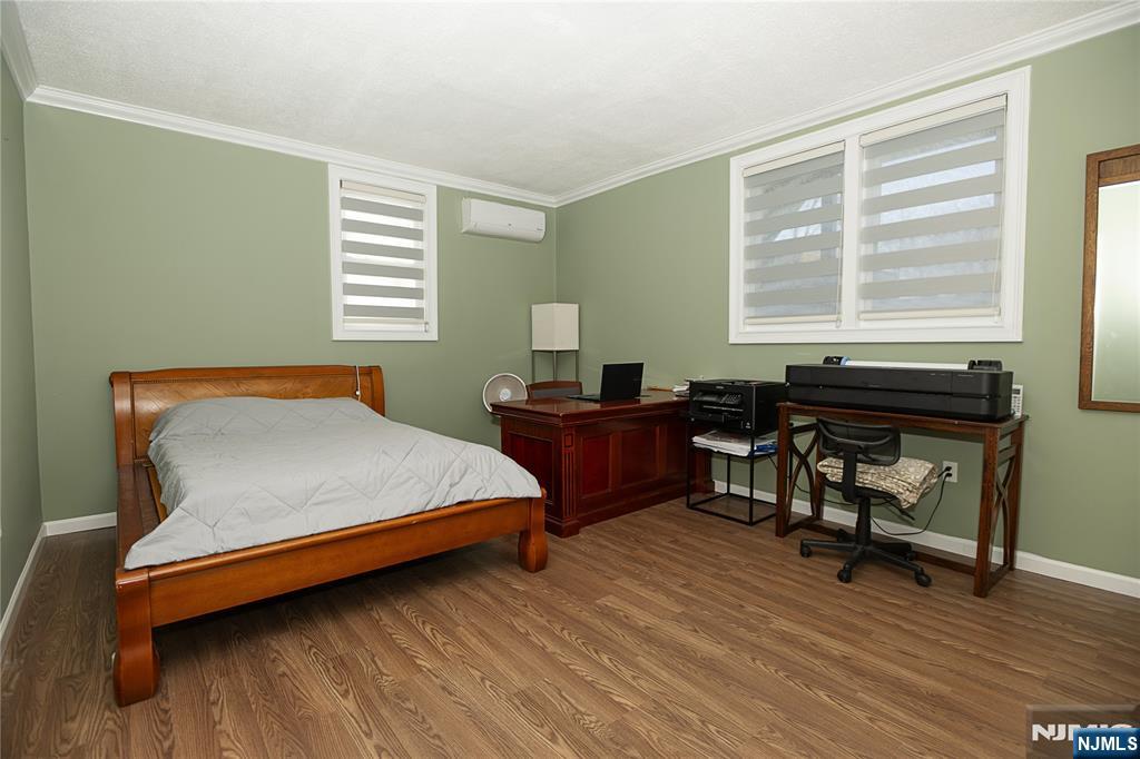 37 Riverside Avenue Little Ferry, NJ 07643 - Photo 20 of 29 a bedroom with a bed and a window