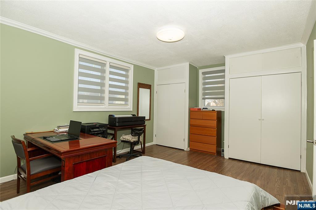 37 Riverside Avenue Little Ferry, NJ 07643 - Photo 21 of 29 a bedroom with a bed and wooden floor