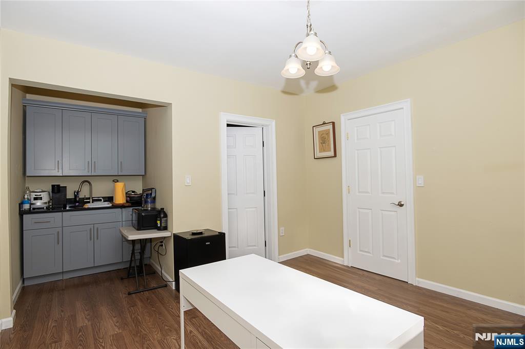 37 Riverside Avenue Little Ferry, NJ 07643 - Photo 24 of 29 a kitchen with a refrigerator and a stove top oven