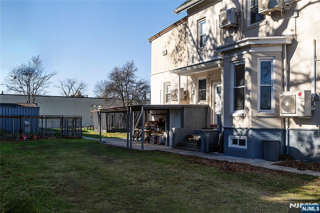 37 Riverside Avenue Little Ferry, NJ 07643 - Photo 25 of 29 a view of a house with a yard fire pit and outdoor seating