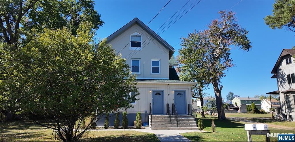 37 Riverside Avenue Little Ferry, NJ 07643 - Photo 27 of 29 a front view of a house with garden