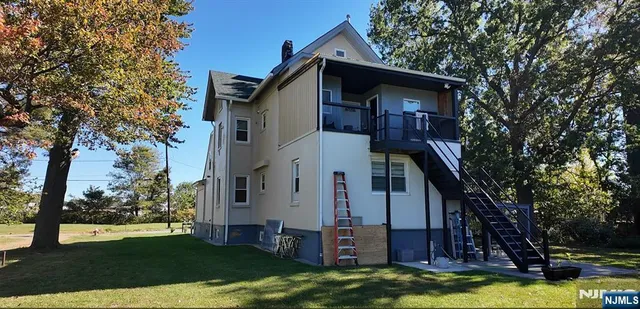an entryway door with wooden floor