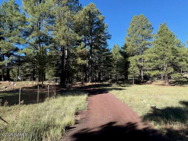 a view of a lake with a house in the background