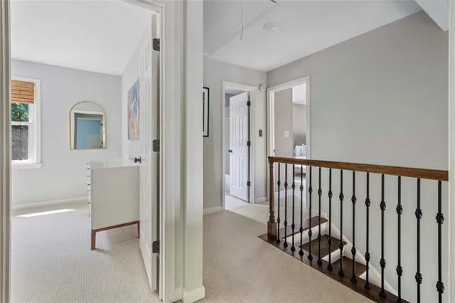 a view of a hallway with entryway door