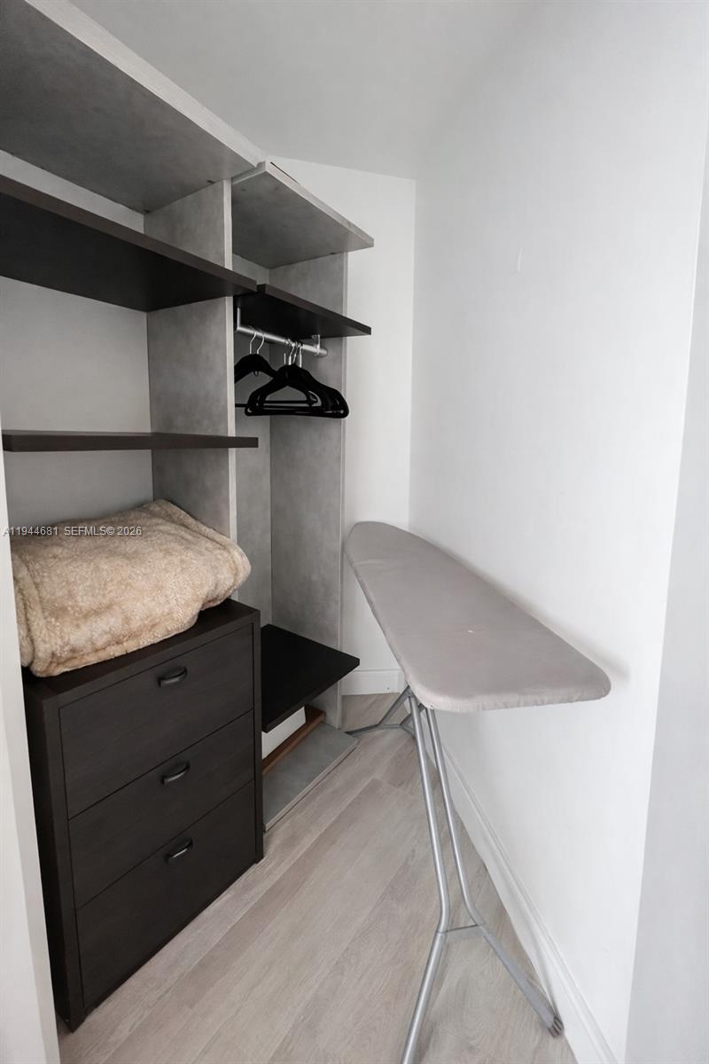 45 Southwest 9th Street, Unit 3008 Miami, FL 33130 - Photo 11 of 16 a bathroom with a sink and a mirror