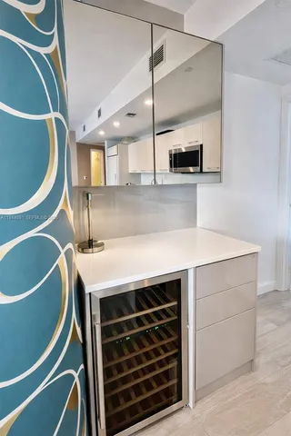 a kitchen with a sink a stove and a microwave