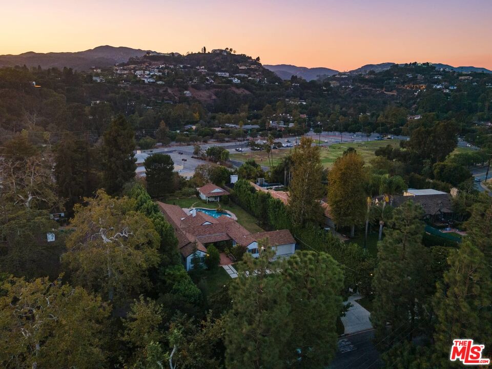 115 South Rockingham Avenue Los Angeles, CA 90049 - Photo 3 of 9 an aerial view of lake residential house and green space