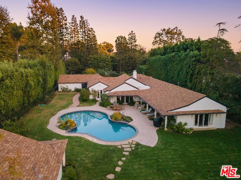 115 South Rockingham Avenue Los Angeles, CA 90049 - Photo 7 of 9 an aerial view of a house and garden