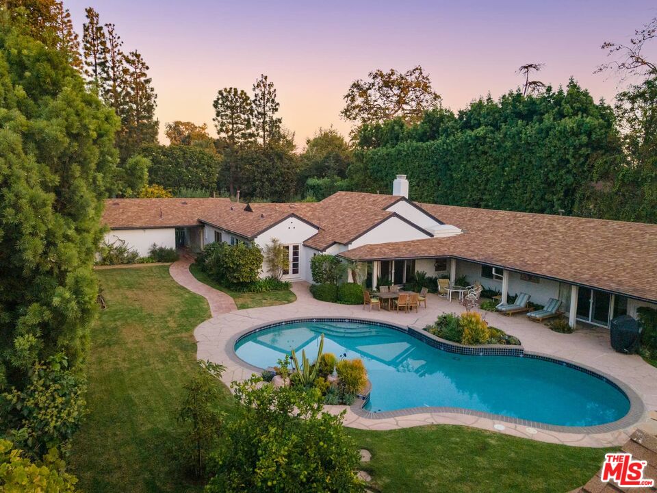 115 South Rockingham Avenue Los Angeles, CA 90049 - Photo 8 of 9 an aerial view of a house with swimming pool and big yard