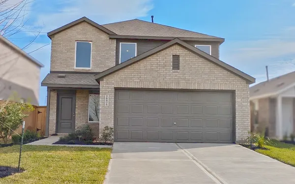 a front view of a house with yard