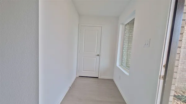 a view of a hallway with windows