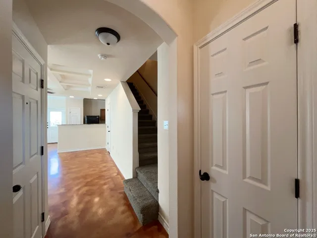 a view of a hallway with white walls