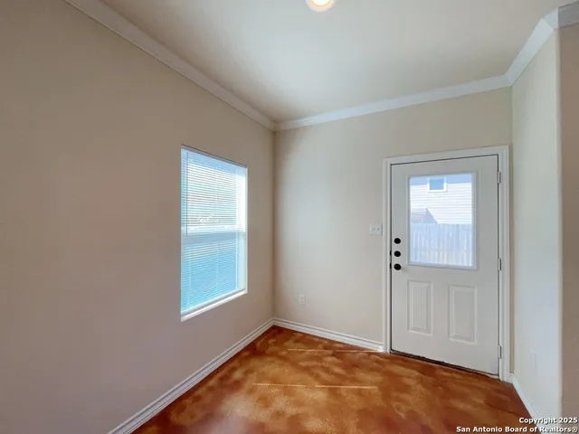 a view of an empty room and window