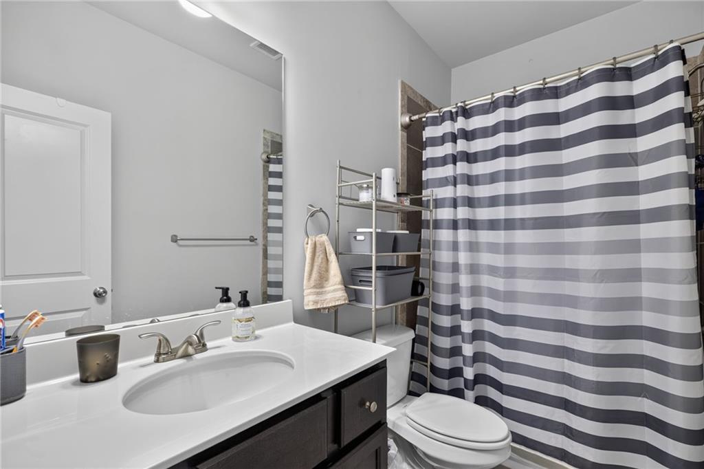 139 Manchester Lane Villa Rica, GA 30180 - Photo 27 of 60 a bathroom with a sink toilet and shower