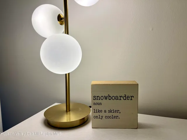 a bathroom with a sink a mirror and a shower