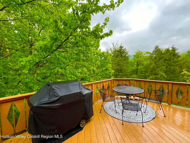 a kitchen with stainless steel appliances granite countertop a stove a sink and a white cabinets