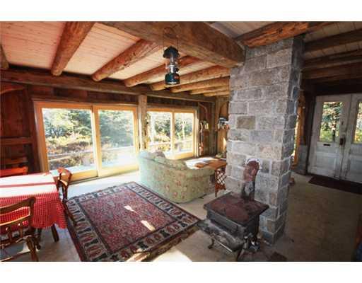 1 Goose Island Addison, ME 04606 - Photo 23 of 30 Living Room. Wood stove heats the...