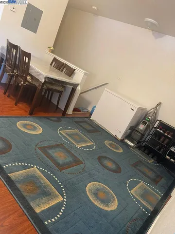 a view of living room with furniture and screen