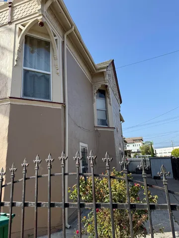 a front view of a house with outdoor seating