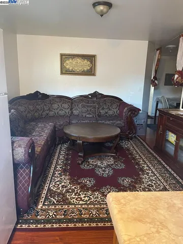 a living room with a rug