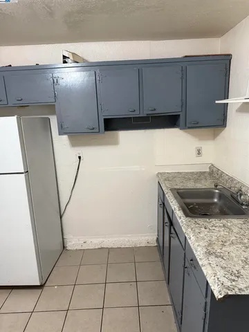a kitchen with stainless steel appliances granite countertop a sink and a stove
